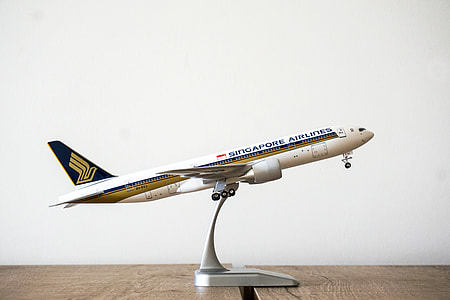 closeup photo of white Singapore Airlines airplane miniature thumbnail