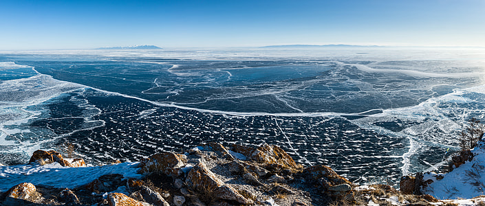 city view of town near mountain under white and blue sky during daytime photography thumbnail
