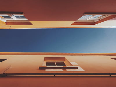 low angle photography of beige buildings thumbnail