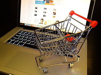 stainless steel push cart toy on top of MacBook thumbnail