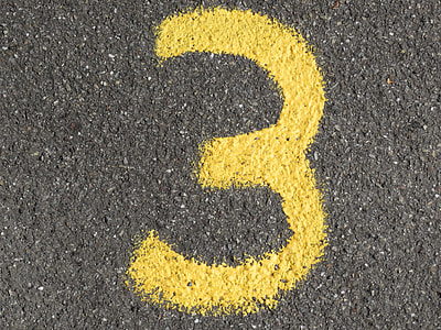 yellow number 3 printed on gray concrete pavement thumbnail