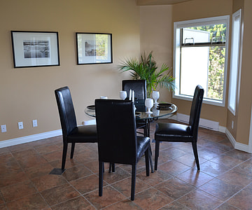 round glass top brown wooden base table with four brown leather padded chairs dining set thumbnail