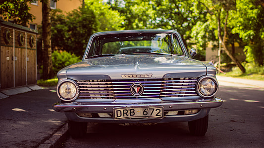 gray vintage coupe on gray road during daytime thumbnail