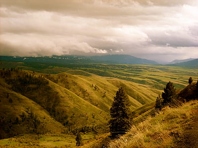 mountains under cloudy sky thumbnail