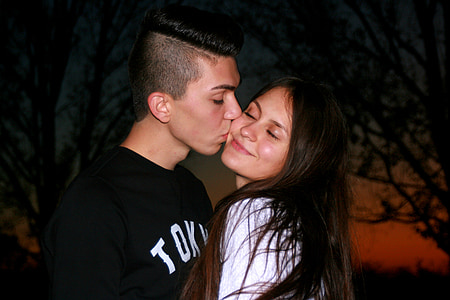 man kissing a long haired woman thumbnail