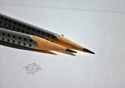 two gray pencils with white paper thumbnail