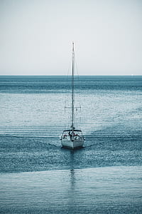 white yacht on body of water during daytime thumbnail