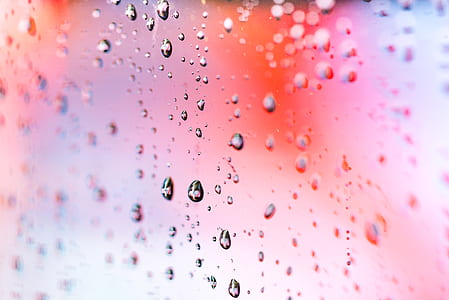 selective focus photography of water drop on glassy side thumbnail