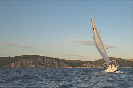 white sailing boat on sea during daytime thumbnail