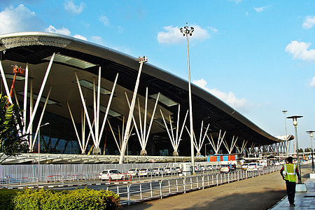 man walking beside stadium thumbnail