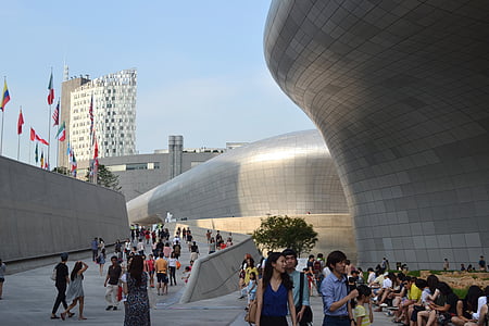 people near gray concrete building during daytime thumbnail