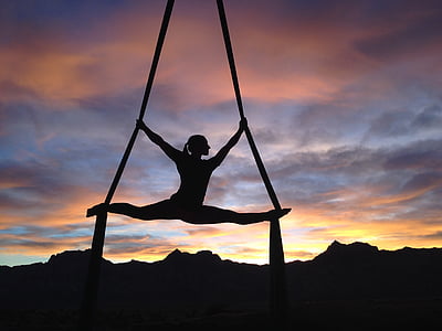 woman silhouette doing air ballet during golden hour thumbnail