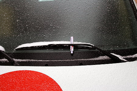 white windshield wiper with snow thumbnail