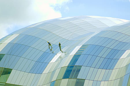 two person walking in glass structure thumbnail