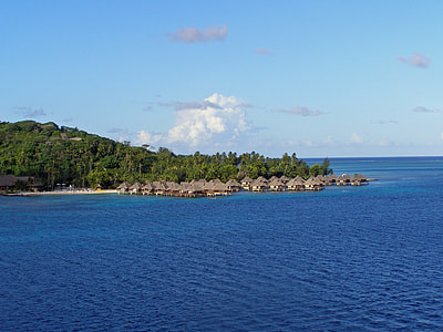 brown wooden housed on body of water thumbnail