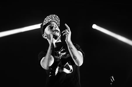 grayscale photo of man singing thumbnail