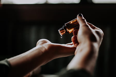 person pour a vial bottle on palm thumbnail