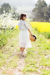 Woman Stands on Green Grass thumbnail