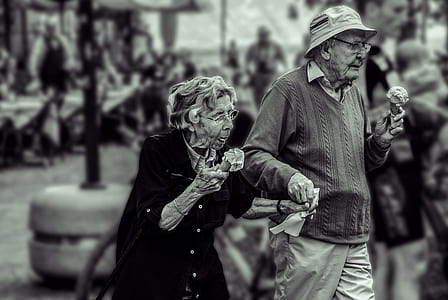 photo of man and woman holding ice creams thumbnail