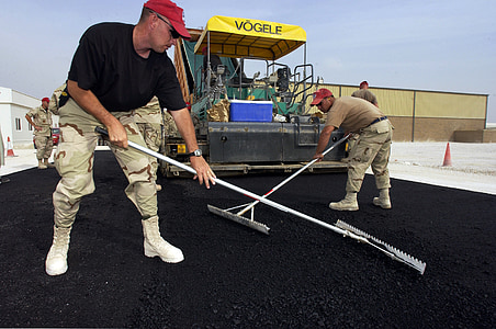 soldiers working on asphalt road thumbnail