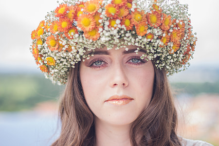 closeup photo of woman wearing flower headdress thumbnail