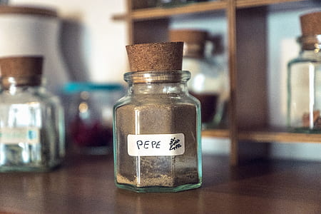 Clear Cork Bottle on Brown Wooden Table thumbnail