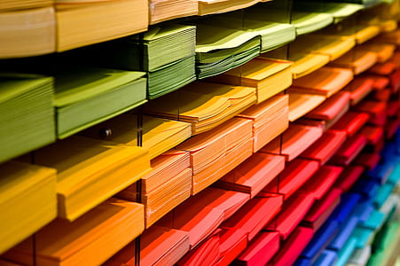 assorted-color of printing papers inside rack thumbnail