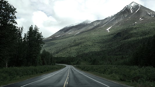 pavement road fronting mountain alps thumbnail