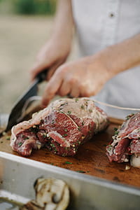 person slicing meat thumbnail