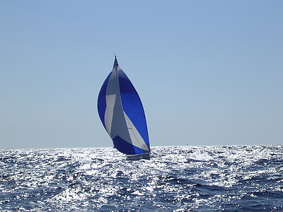blue and gray sailboat on body of water during daytime thumbnail