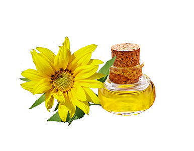 yellow petaled flower beside clear glass bottle thumbnail