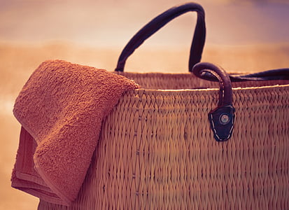 macro shot of brown towel on brown wicker bag thumbnail