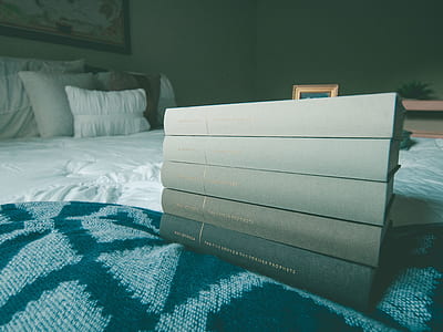 five black books on black and gray textile thumbnail