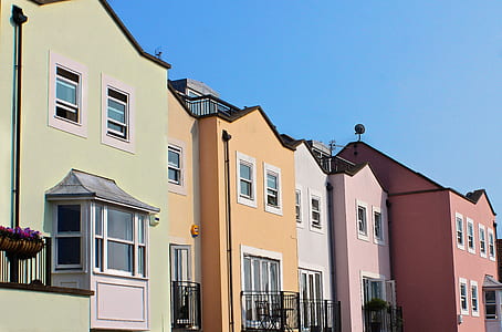 assorted-color painted buildings during daytime photography thumbnail