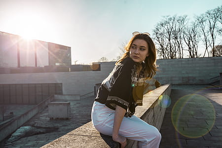 Woman in Black Top and White Pants thumbnail