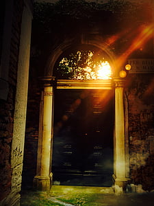 black wooden door beside brown concrete wall thumbnail