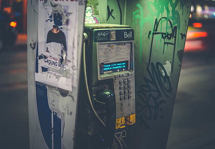 gray and black telephone booth during nighttime thumbnail