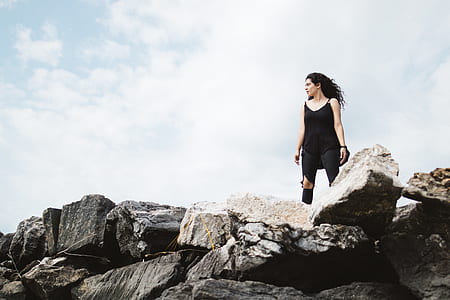 woman standing on rock thumbnail