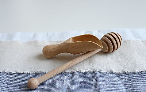 brown wooden honey comb and honey scoop thumbnail