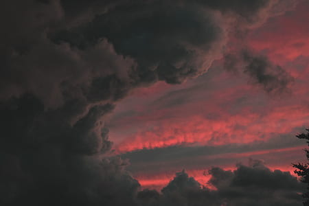 dark clouds with rays of sunset thumbnail