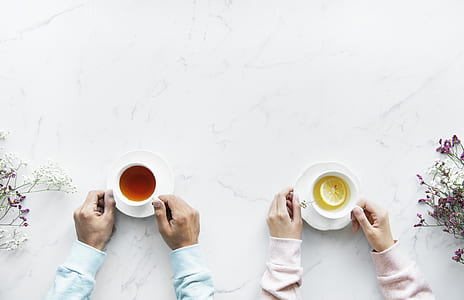 people holding cups with tea s thumbnail