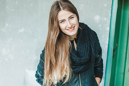 woman wearing black leather zip-up jacket with black crochet scurf thumbnail