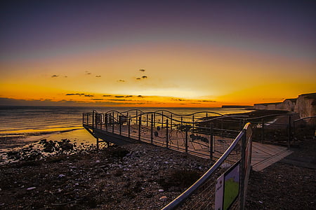 beach dock during golden hour thumbnail