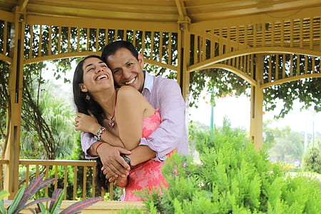 man hugging the woman wearing pink dress thumbnail