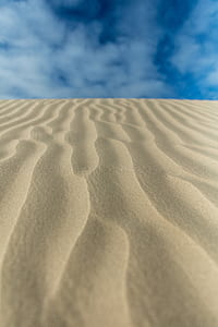 closeup photo of gray sand thumbnail