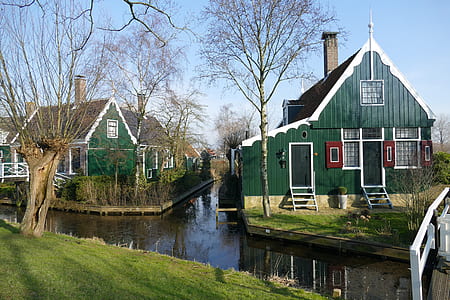 green house beside body of water thumbnail