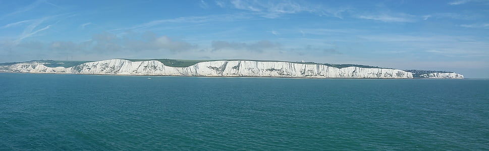 panoramic photo of ocean and island thumbnail