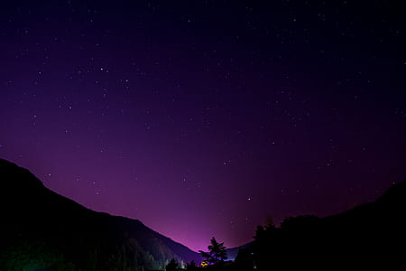 purple night sky above mountains thumbnail