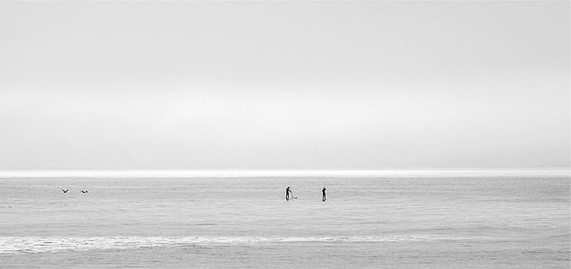 two black posts in sea at daytime thumbnail