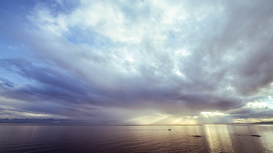 body of water under blue and white sky at daytime thumbnail